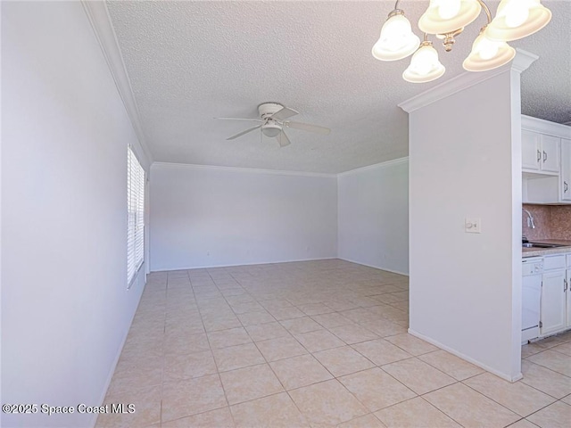 28 Pine Arbor Ln Unit 206, Vero Beach, FL 32962 - spare room featuring a textured ceiling, crown molding, light tile patterned floors, a sink, and ceiling fan with notable chandelier