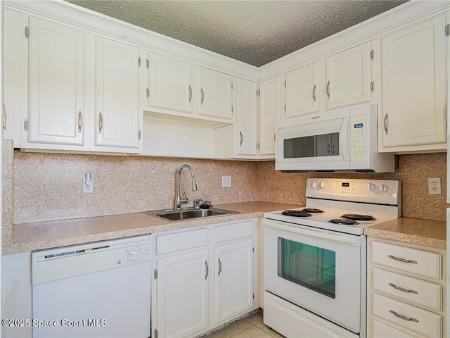 28 Pine Arbor Ln Unit 206, Vero Beach, FL 32962 - kitchen with a sink, light countertops, tasteful backsplash, and white appliances