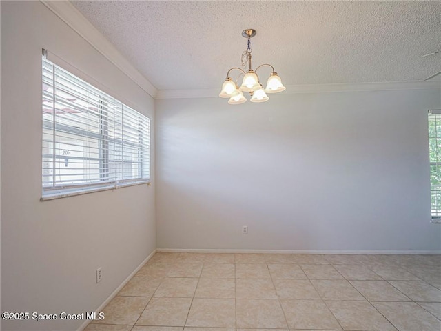 28 Pine Arbor Ln Unit 206, Vero Beach, FL 32962 - unfurnished room with ornamental molding, baseboards, a textured ceiling, a chandelier, and light tile patterned floors