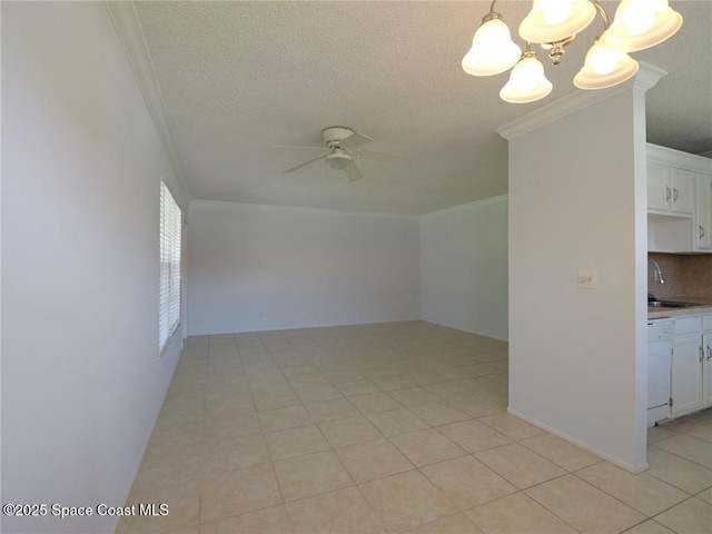 28 Pine Arbor Ln Unit 206, Vero Beach, FL 32962 - spare room with light tile patterned floors, ornamental molding, ceiling fan with notable chandelier, and a textured ceiling