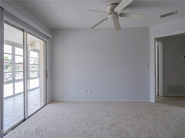 28 Pine Arbor Ln Unit 206, Vero Beach, FL 32962 - empty room featuring a ceiling fan, carpet flooring, and visible vents