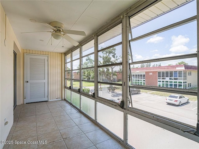 28 Pine Arbor Ln Unit 206, Vero Beach, FL 32962 - unfurnished sunroom with a ceiling fan