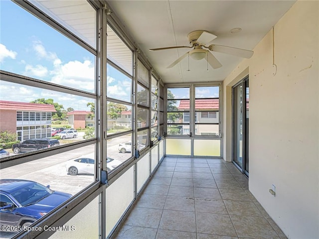 28 Pine Arbor Ln Unit 206, Vero Beach, FL 32962 - unfurnished sunroom featuring ceiling fan