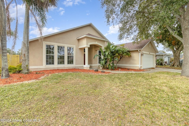 view of front facade featuring a garage and a front lawn