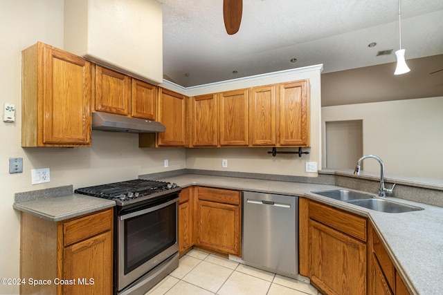 kitchen featuring pendant lighting, sink, ceiling fan, light tile patterned floors, and appliances with stainless steel finishes