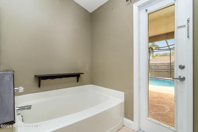 bathroom with a tub to relax in