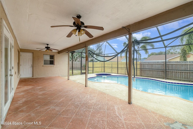 view of swimming pool with a lanai and a patio