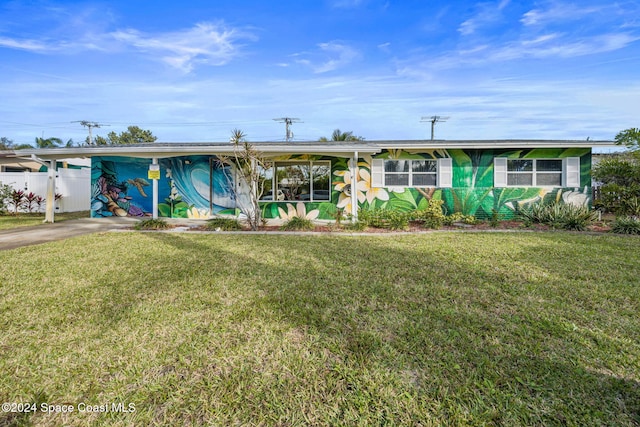 ranch-style home featuring a front yard and a carport