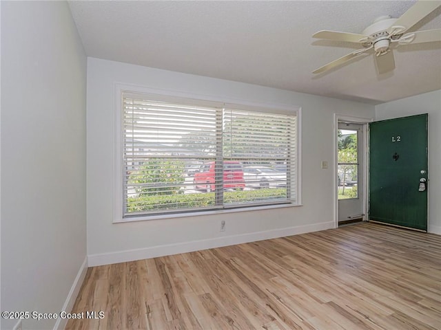 2800 Indian River Blvd Unit L-2, Vero Beach, FL 32960 - empty room with light wood-type flooring, a ceiling fan, and baseboards