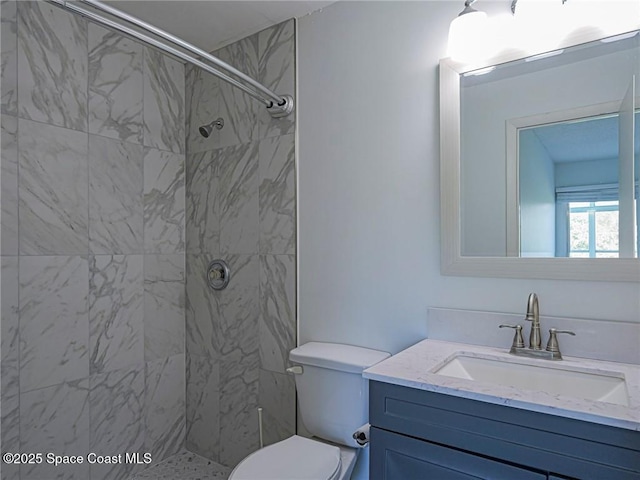 2800 Indian River Blvd Unit L-2, Vero Beach, FL 32960 - bathroom with a tile shower, vanity, and toilet
