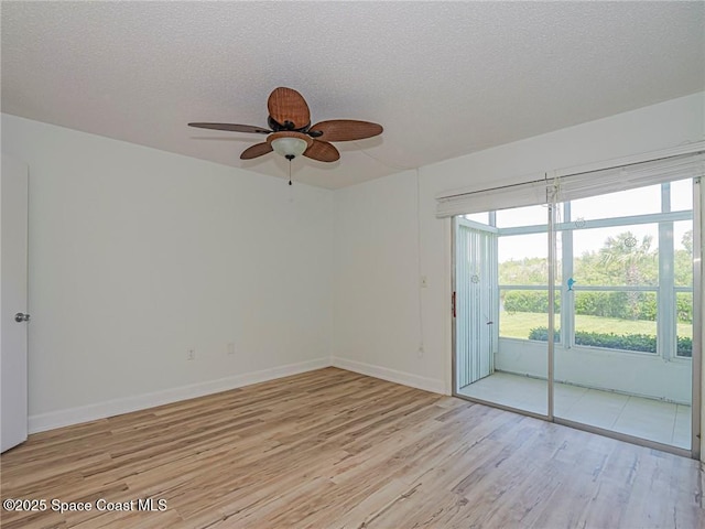 2800 Indian River Blvd Unit L-2, Vero Beach, FL 32960 - spare room with light wood finished floors, a ceiling fan, healthy amount of natural light, a textured ceiling, and baseboards