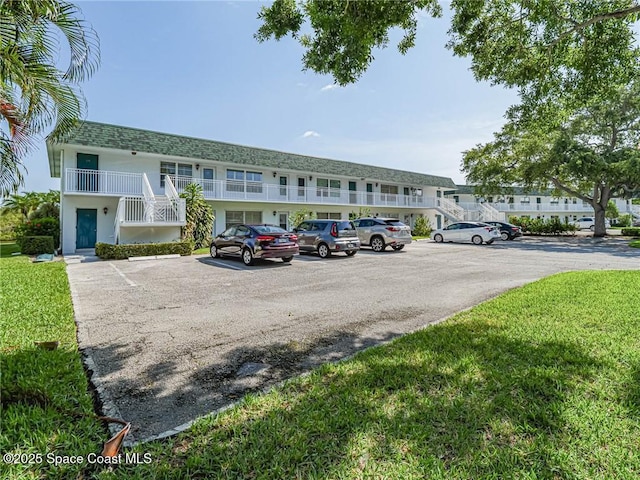 2800 Indian River Blvd Unit L-2, Vero Beach, FL 32960 - view of building exterior with uncovered parking