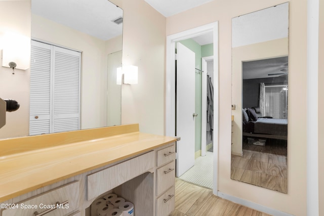 bathroom featuring vanity and hardwood / wood-style flooring