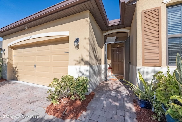 entrance to property featuring a garage