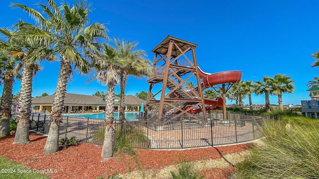 view of playground featuring a community pool