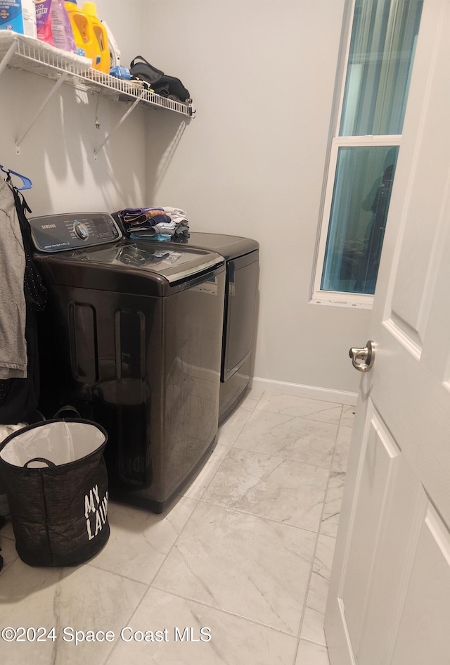 laundry room with washer and dryer