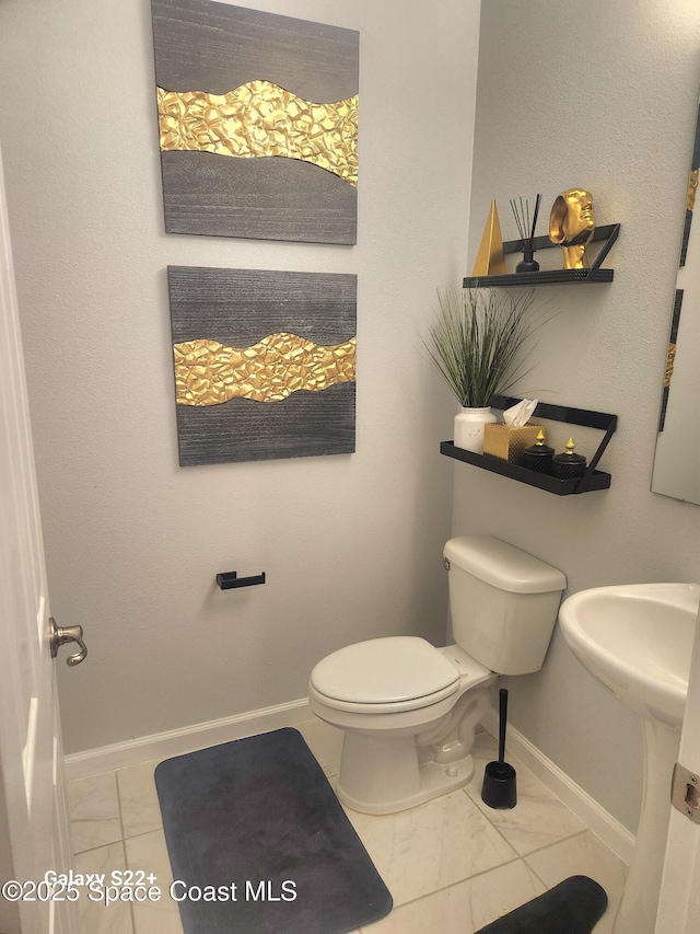 1631 Wake Forest Rd NW, Palm Bay, FL 32907 - half bath featuring toilet and baseboards