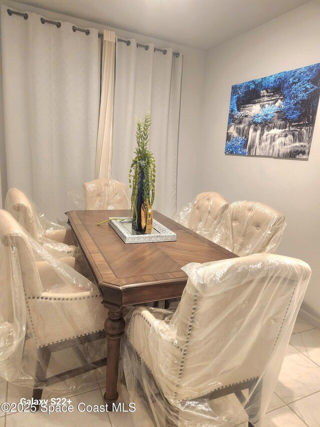 1631 Wake Forest Rd NW, Palm Bay, FL 32907 - dining space with marble finish floor
