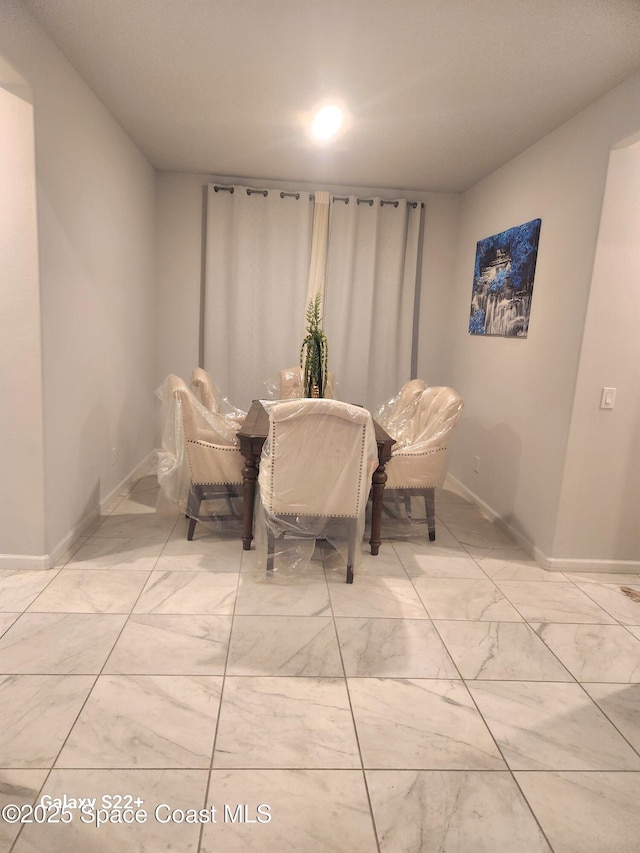 1631 Wake Forest Rd NW, Palm Bay, FL 32907 - dining space with marble finish floor and baseboards