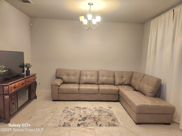 1631 Wake Forest Rd NW, Palm Bay, FL 32907 - living room featuring marble finish floor, an inviting chandelier, and a textured ceiling
