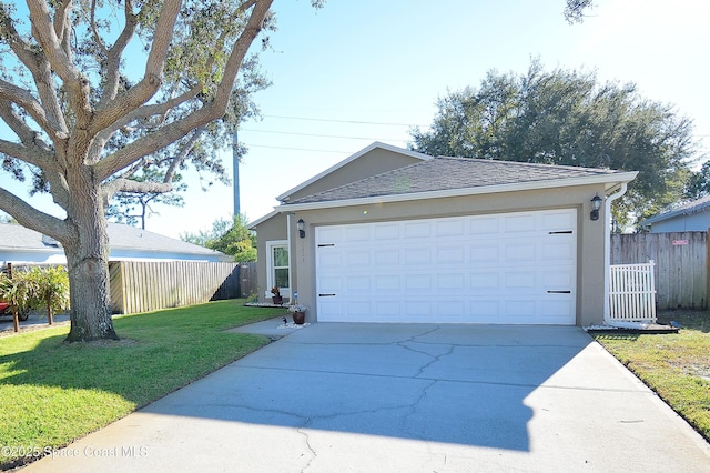 view of front of home with a garage and a front yard