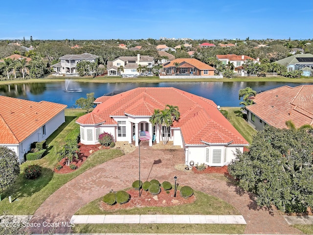 birds eye view of property with a water view