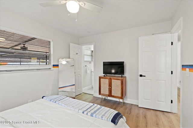 bedroom featuring light hardwood / wood-style floors and ceiling fan