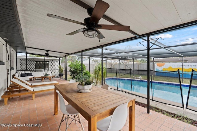 exterior space featuring outdoor lounge area, a fenced in pool, and a lanai