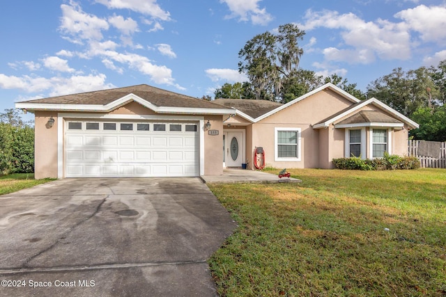 single story home with a front lawn and a garage