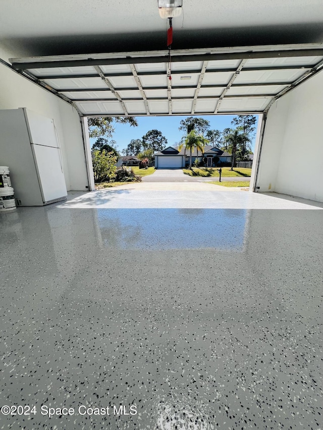 garage with white refrigerator