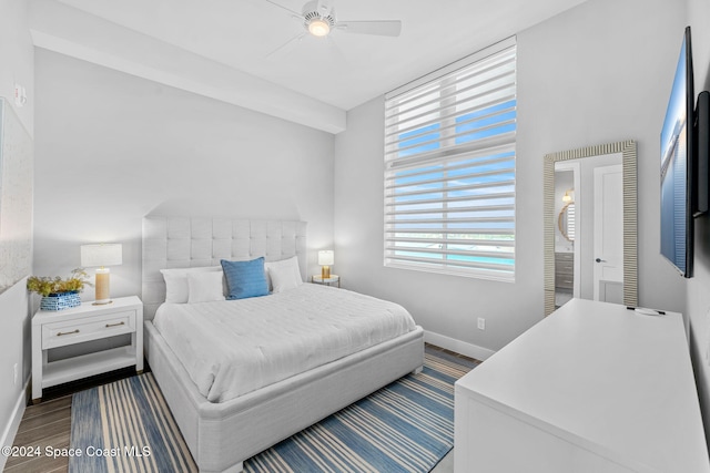 bedroom with ceiling fan and dark hardwood / wood-style floors