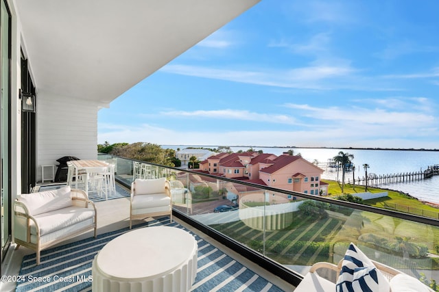 balcony featuring a water view