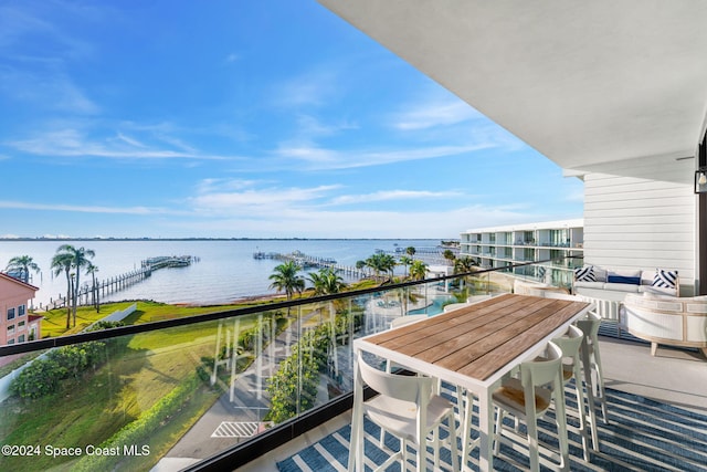 balcony featuring a water view