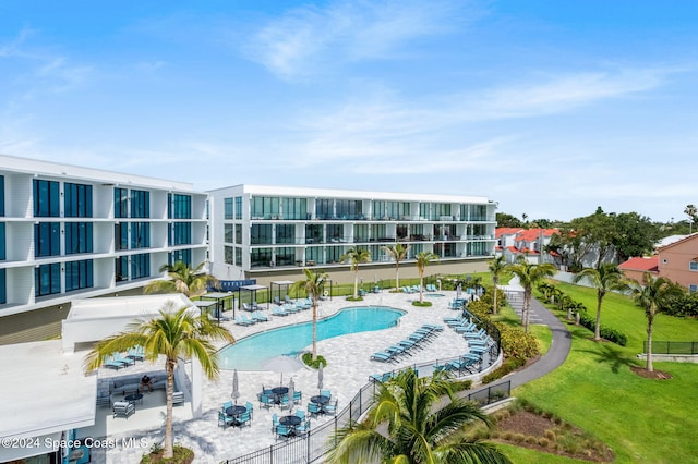 view of swimming pool featuring a patio area