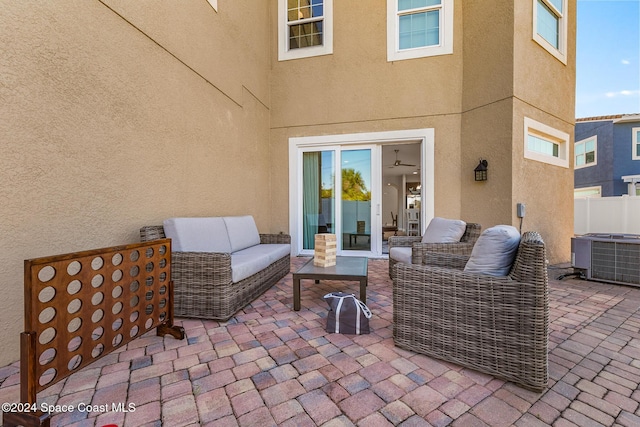 view of patio with outdoor lounge area and central AC unit