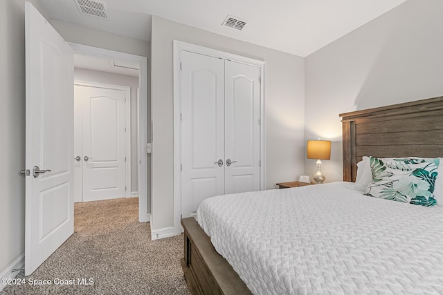 bedroom with carpet floors and a closet