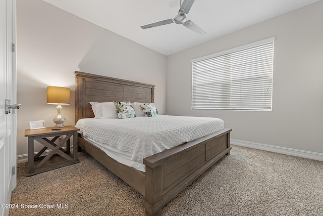 bedroom featuring ceiling fan and light colored carpet