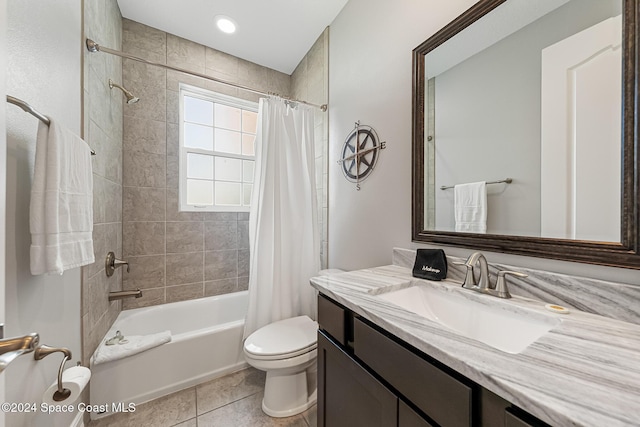 full bathroom with toilet, vanity, tile patterned floors, and shower / tub combo with curtain