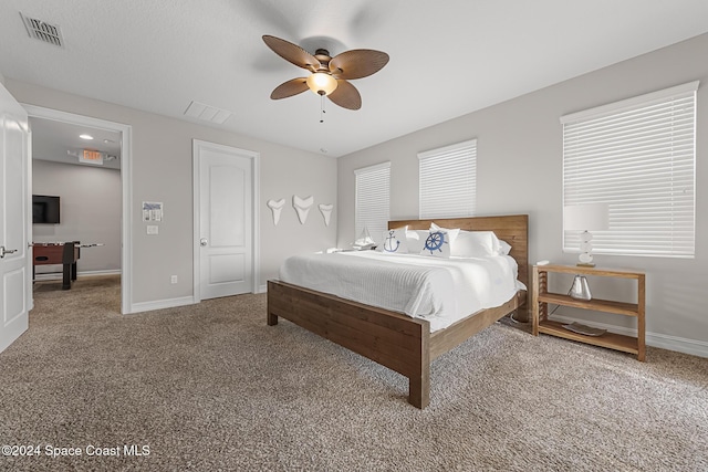 carpeted bedroom featuring ceiling fan