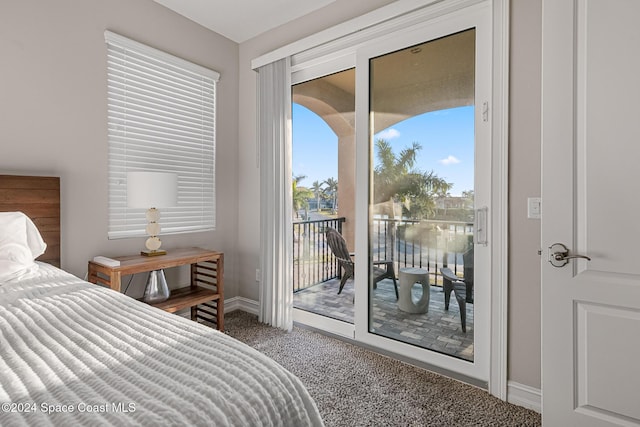 bedroom with access to outside and carpet flooring