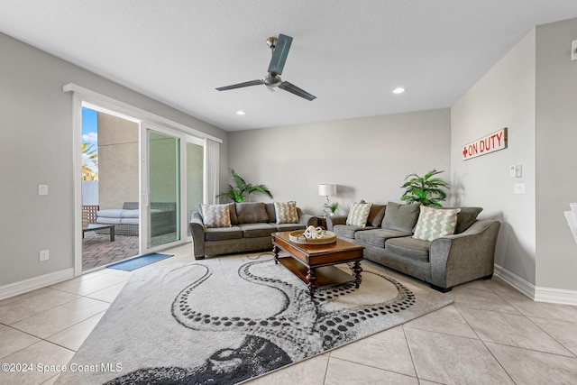 living room with ceiling fan and light tile patterned floors