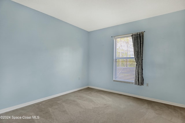 empty room featuring light carpet