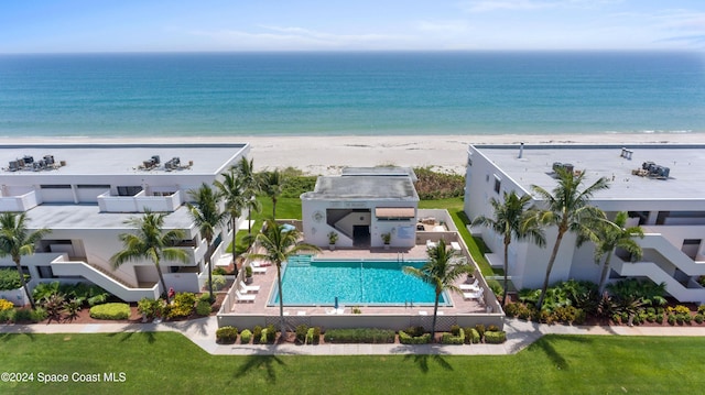 drone / aerial view with a water view and a view of the beach