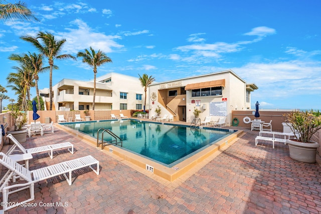 view of swimming pool with a patio area