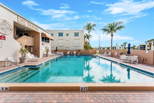 view of swimming pool with a patio area