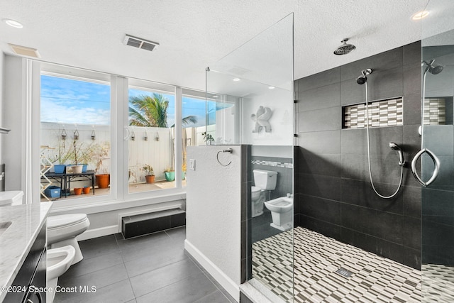 bathroom featuring tile patterned floors, an enclosed shower, a textured ceiling, a bidet, and toilet