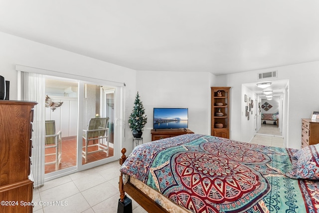 bedroom with light tile patterned flooring