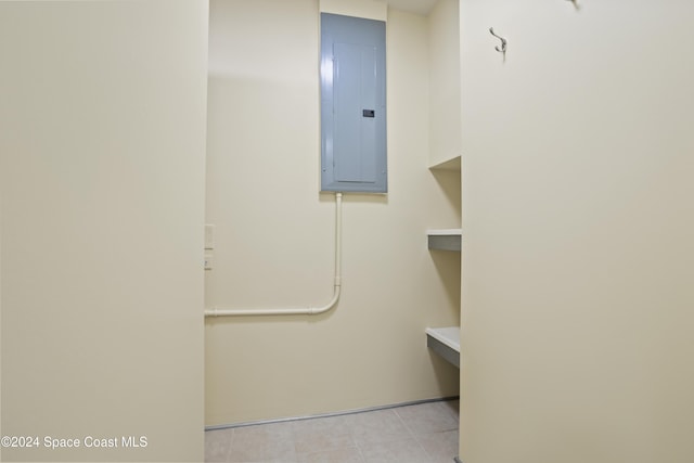 washroom with light tile patterned floors and electric panel