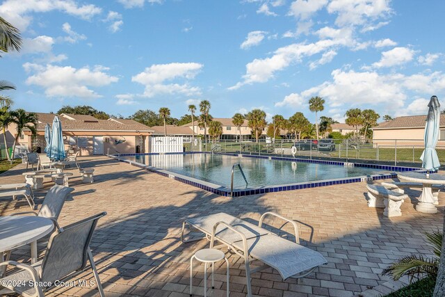 view of swimming pool with a patio area