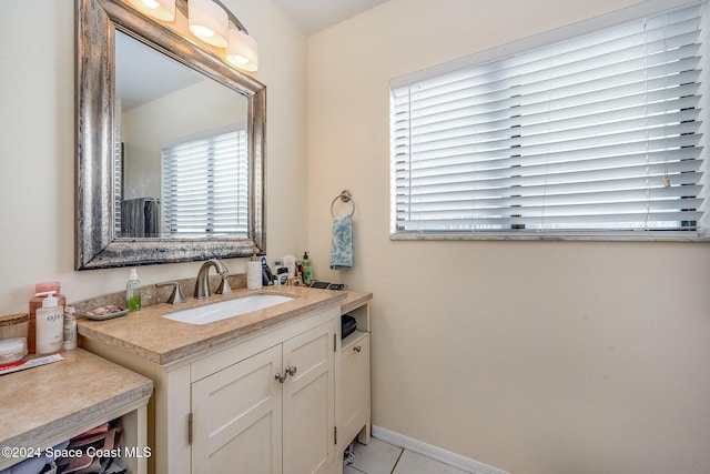 bathroom with tile patterned floors and vanity